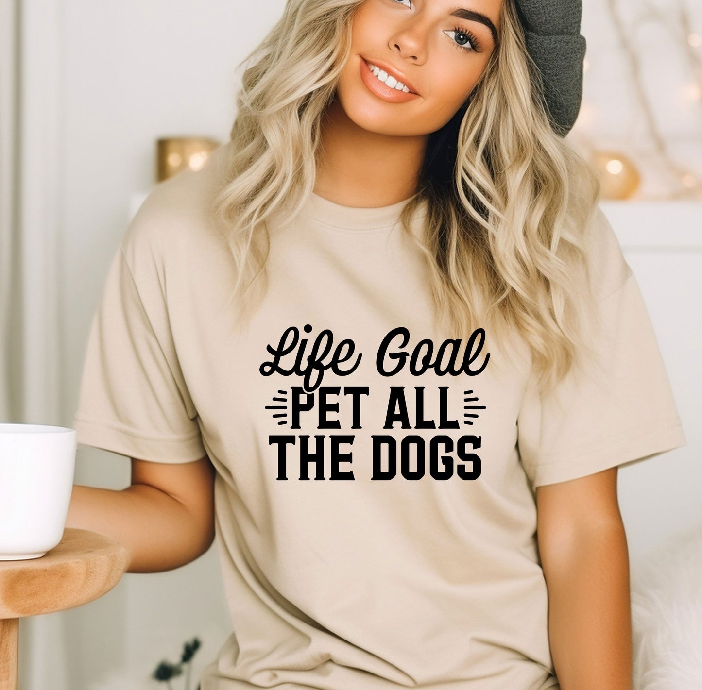 a woman wearing a t - shirt that says life goal pet all the dogs