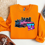 an orange shirt with a pink car on it