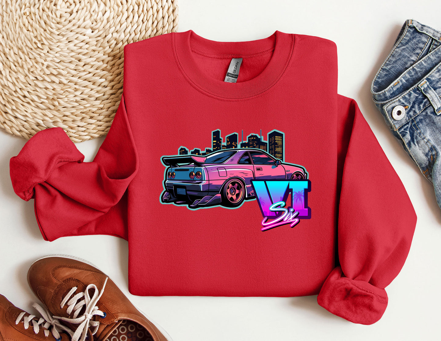 a red shirt with a pink car on it