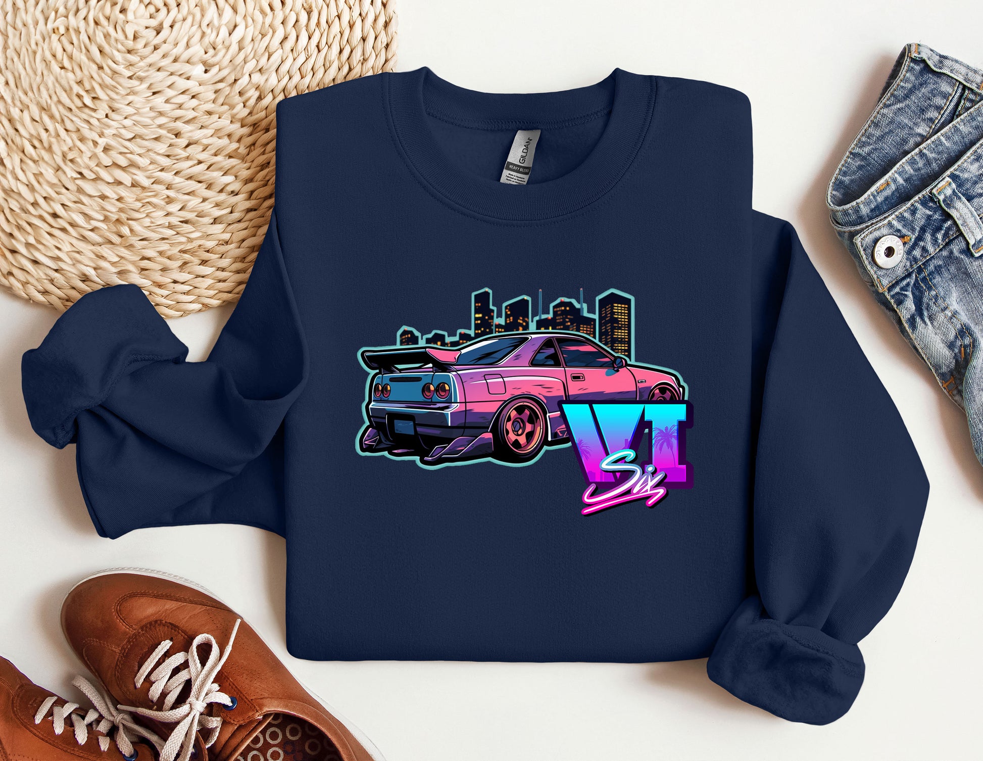 a blue shirt with a pink car on it