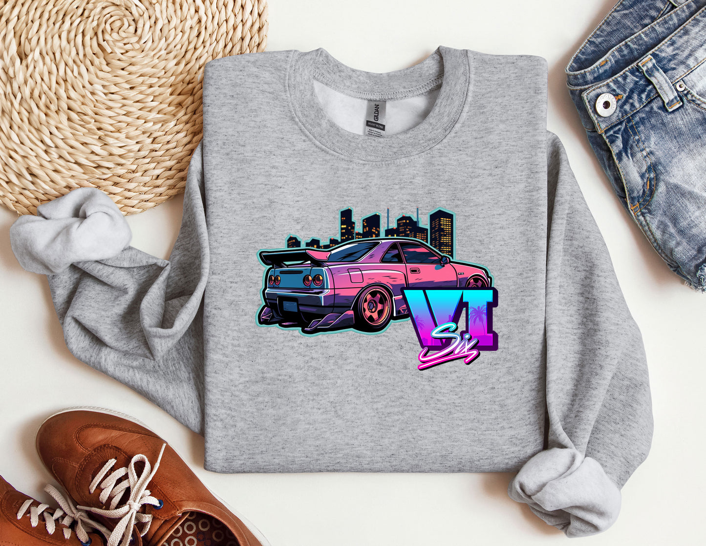 a gray shirt with a pink car on it