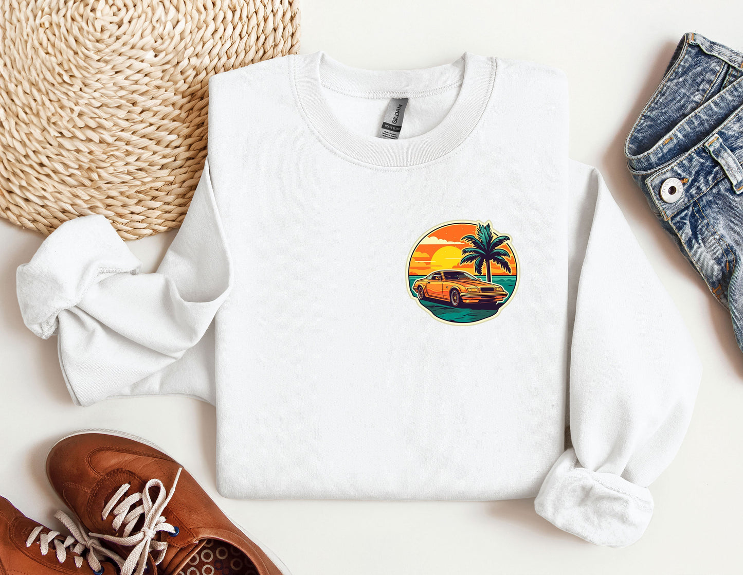 a white sweatshirt with a palm tree on it