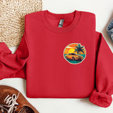 a red sweatshirt with a palm tree and a car on it