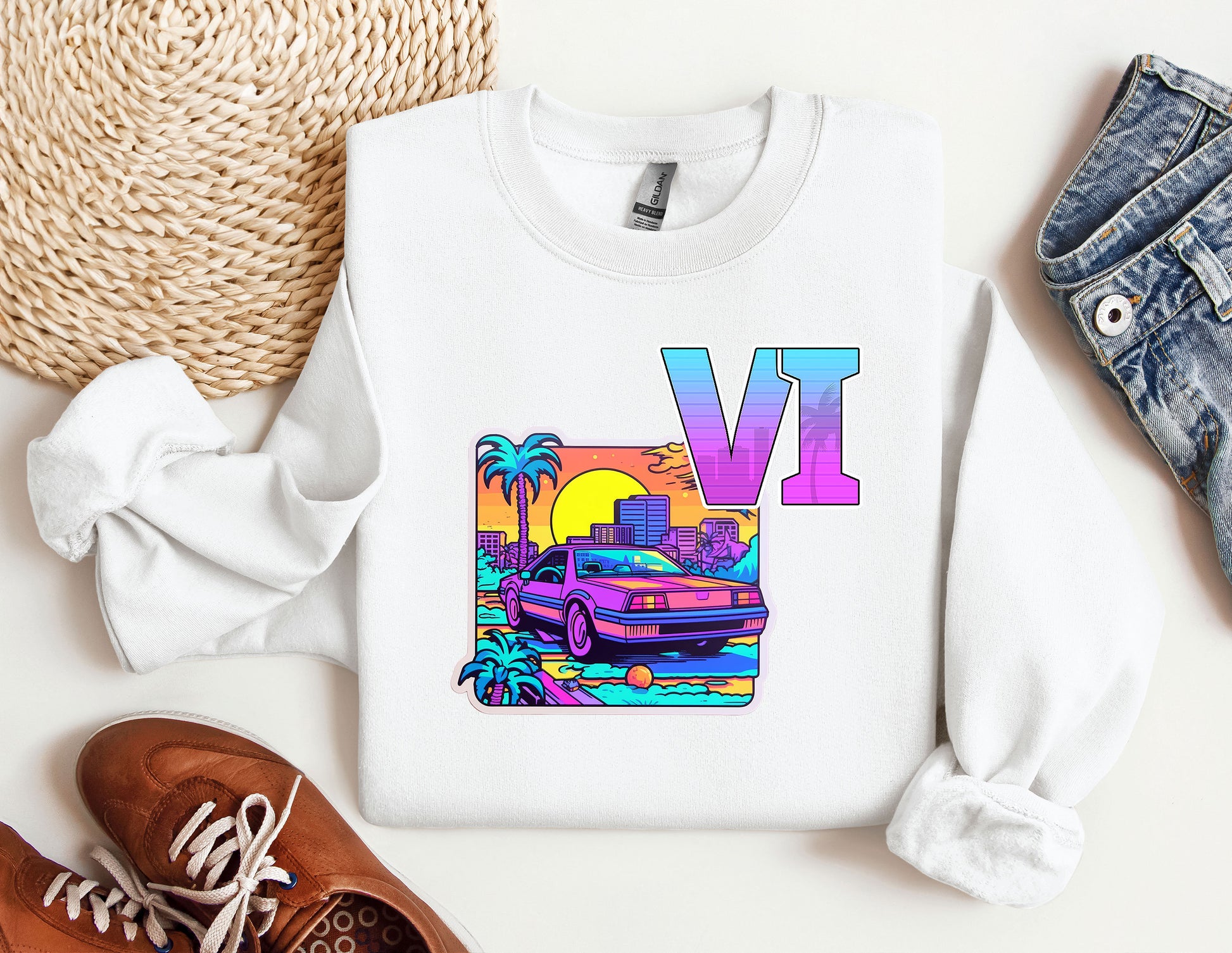 a white sweatshirt with a v v on it next to a pair of shoes