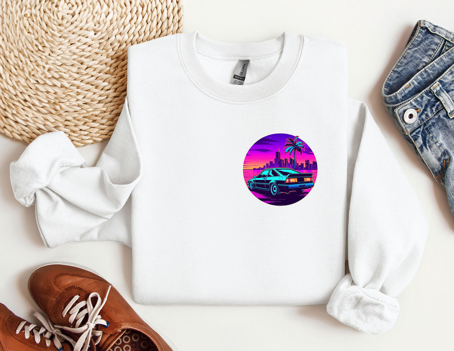 a white sweatshirt with a picture of a car and palm trees on it