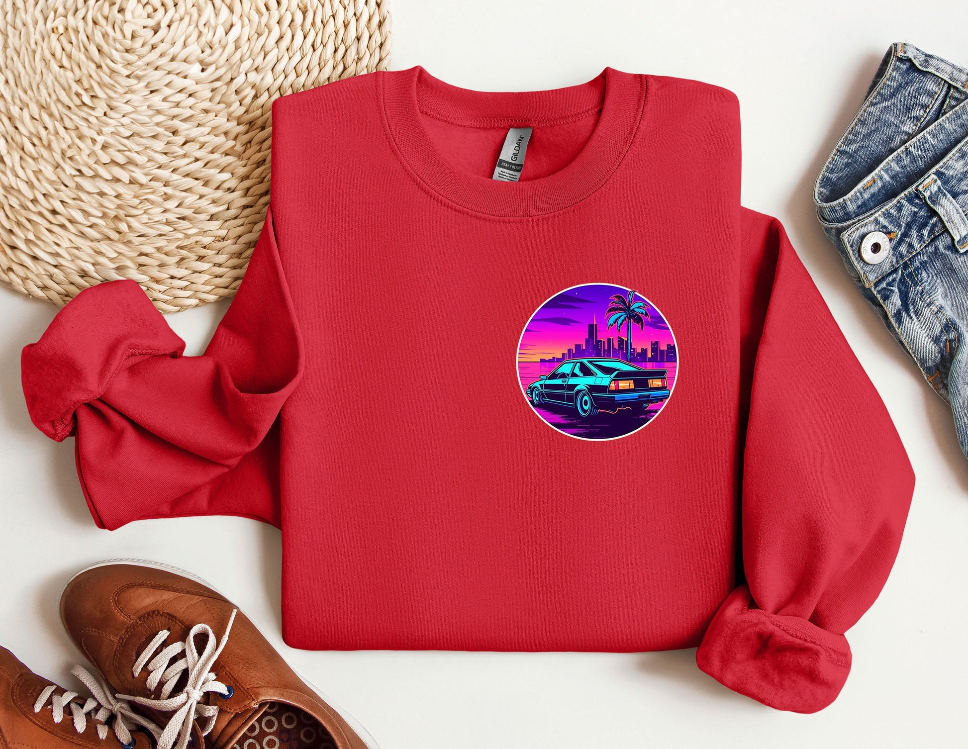 a red sweatshirt with a picture of a car on it