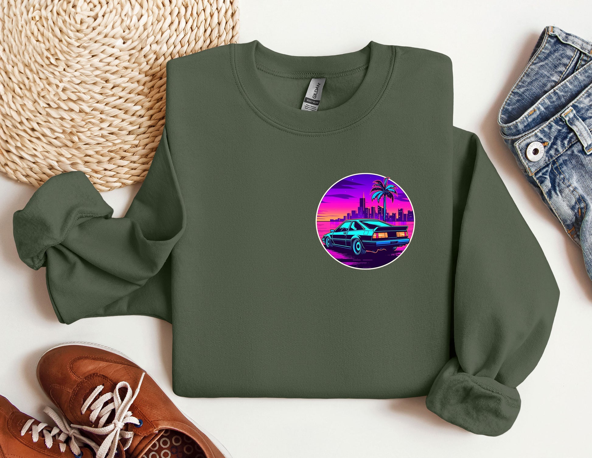 a green sweatshirt with a picture of a car on it