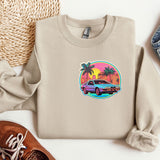 a sweater with a car on it next to a pair of shoes