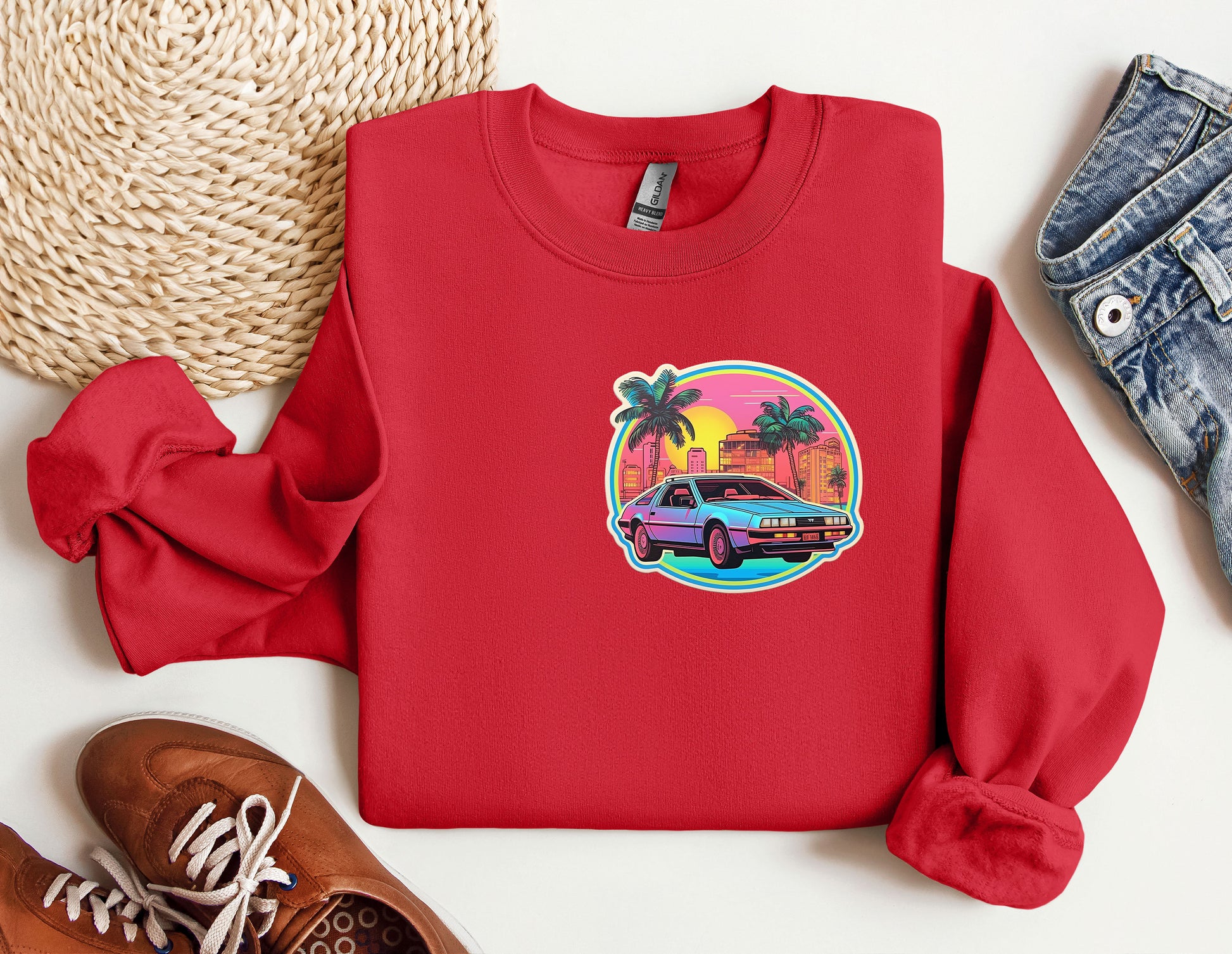 a red sweatshirt with a picture of a car on it