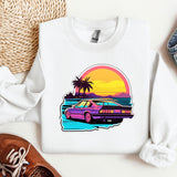 a white shirt with a purple car and palm trees on it