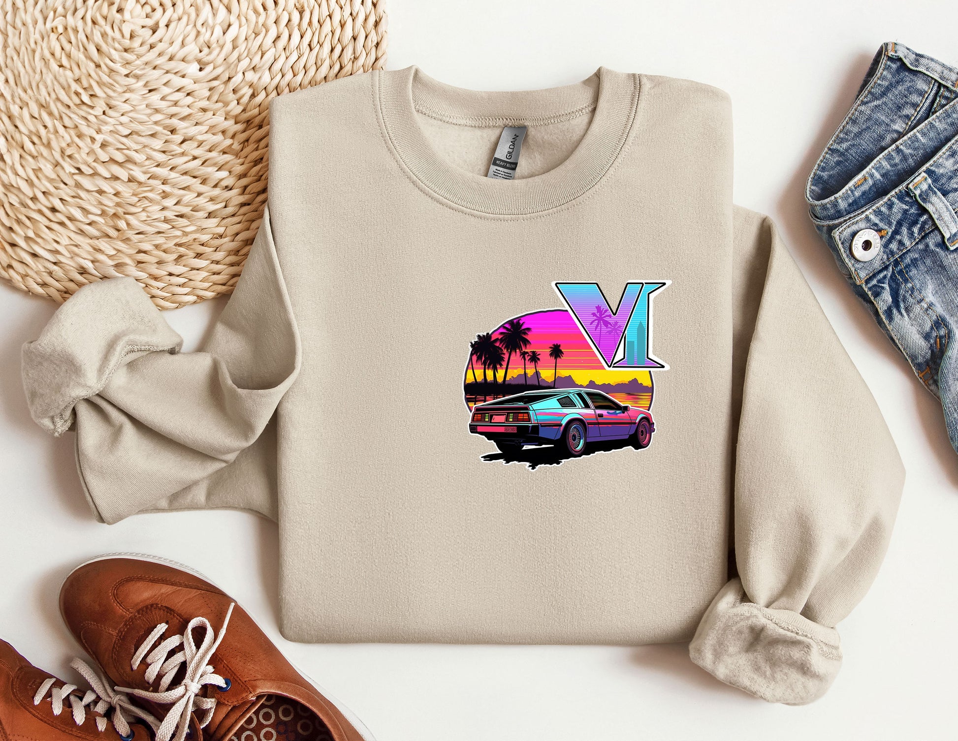 a sweater with the letter y on it next to a pair of shoes