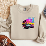a sweater with the letter y on it next to a pair of shoes