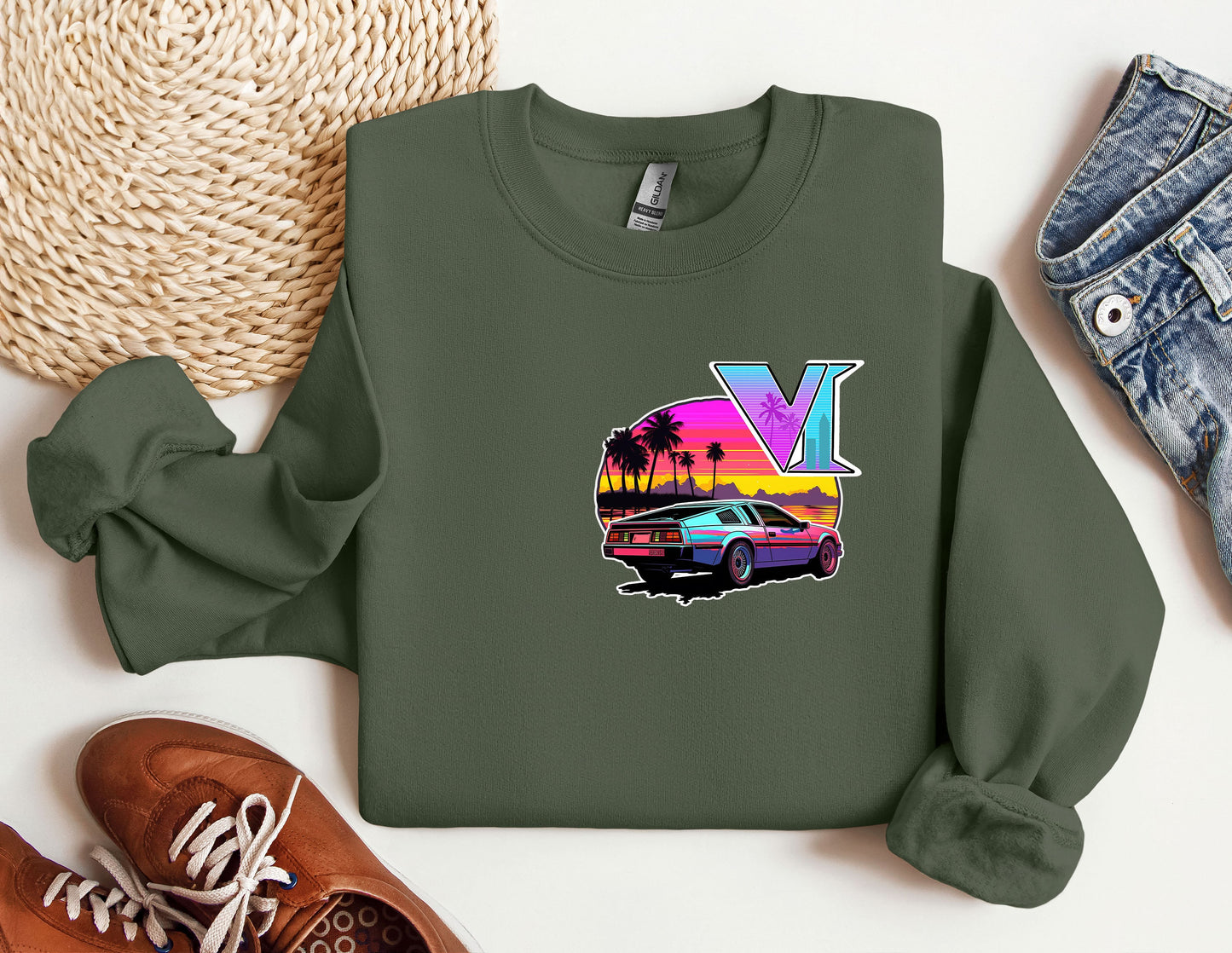 a green sweatshirt with a picture of a car and palm trees