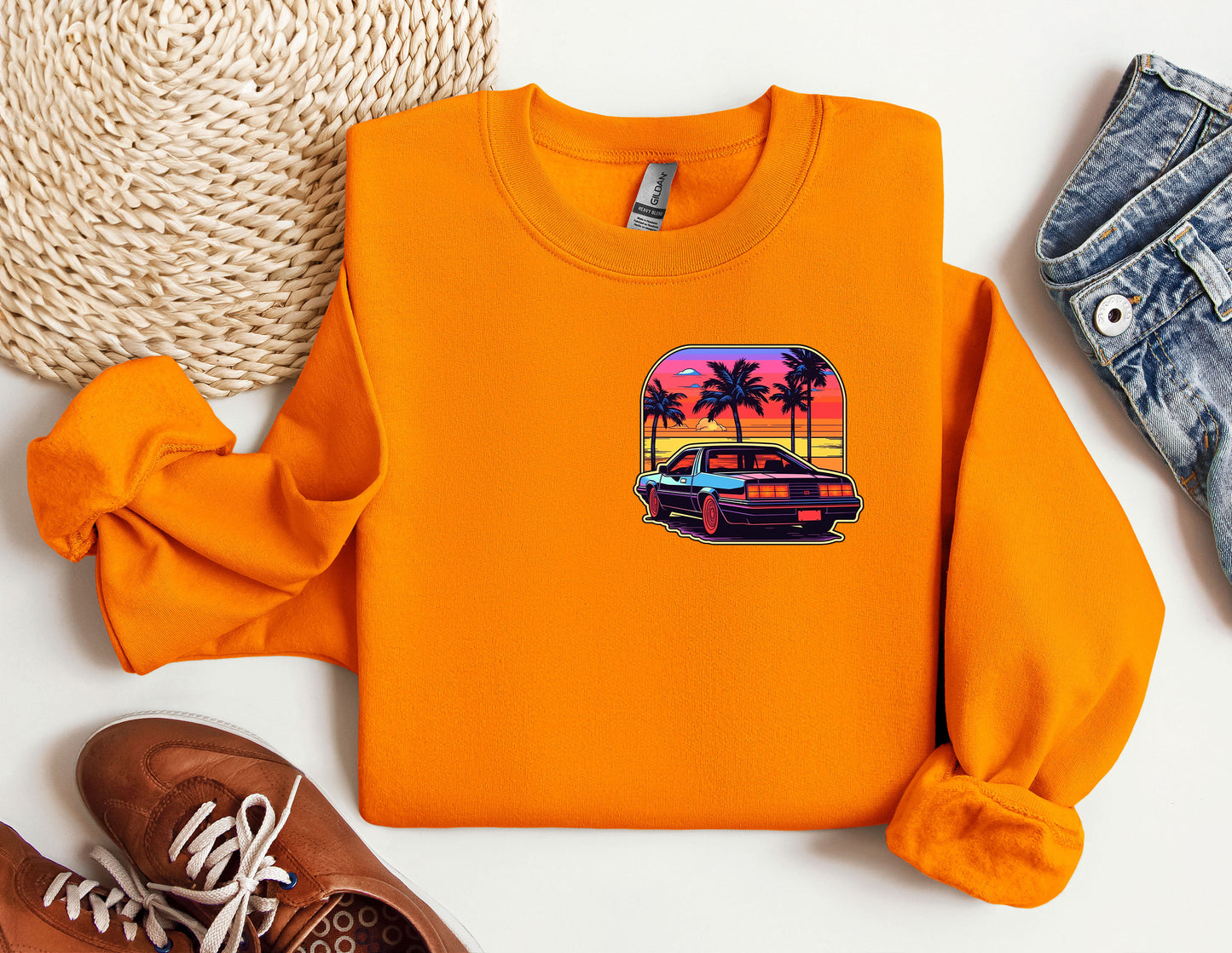 an orange shirt with a picture of a car on it