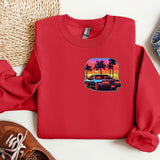 a red shirt with a picture of a car and palm trees