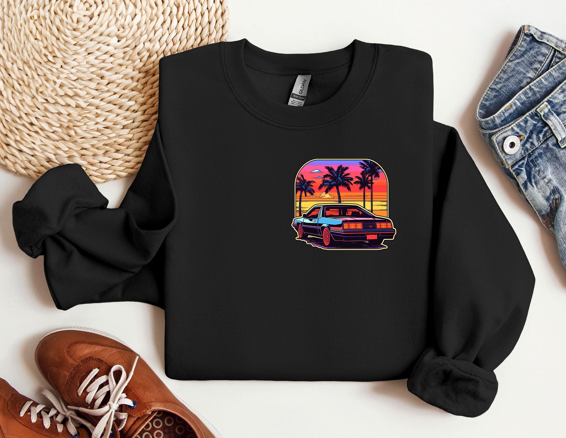 a black shirt with a picture of a car and palm trees