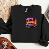 a black shirt with a picture of a car and palm trees