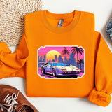 an orange sweatshirt with a picture of a car on it
