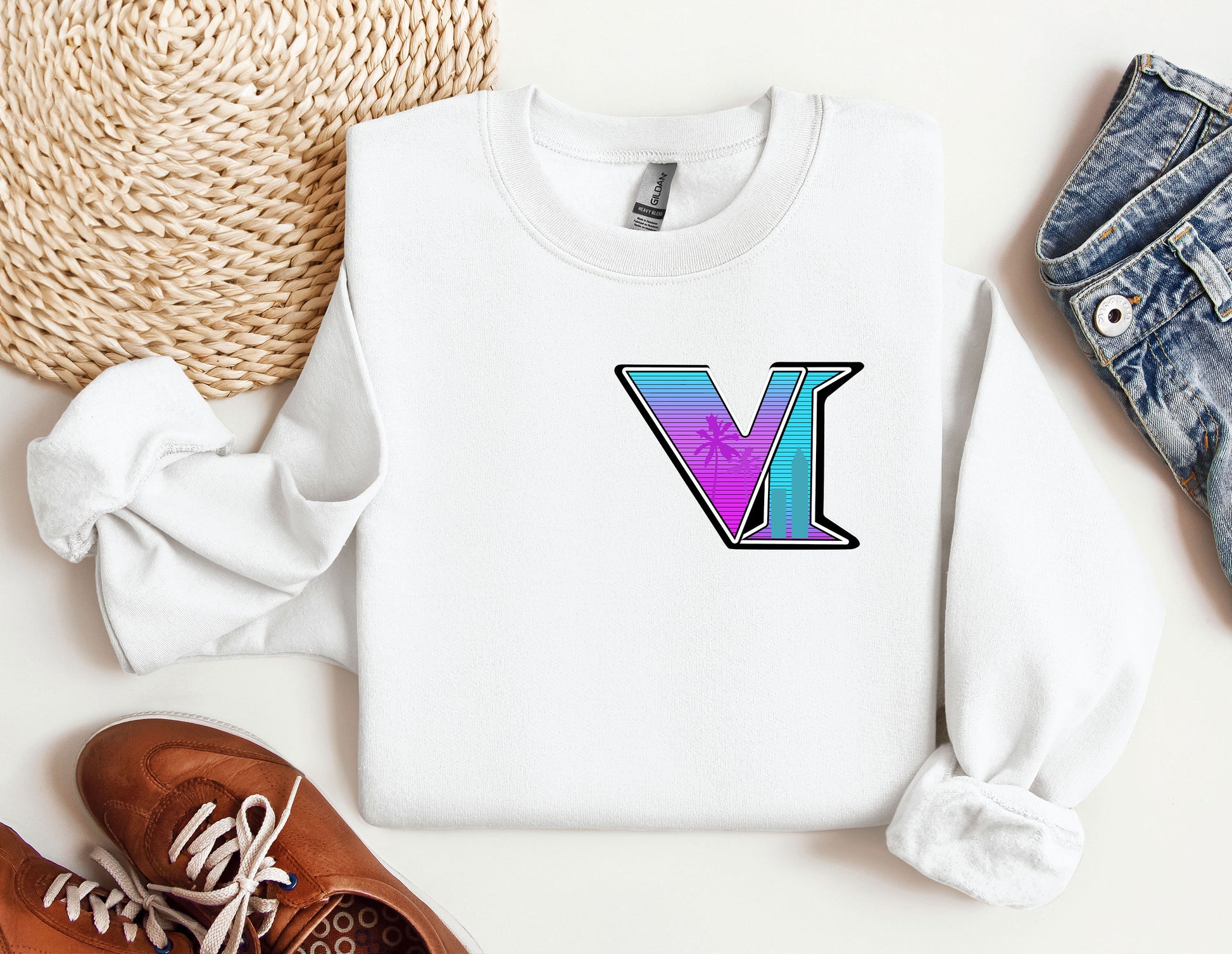 a sweater with the letter v on it next to a pair of shoes