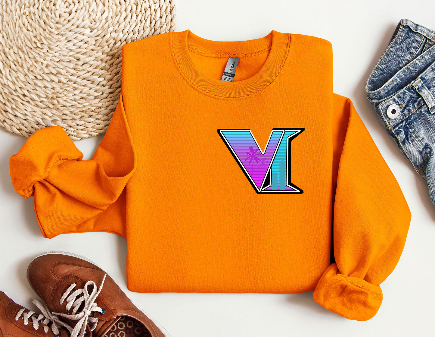 a pair of shoes and a sweater with the letter v on it