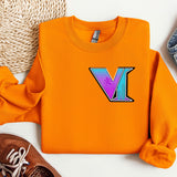 a pair of shoes and a sweater with the letter v on it