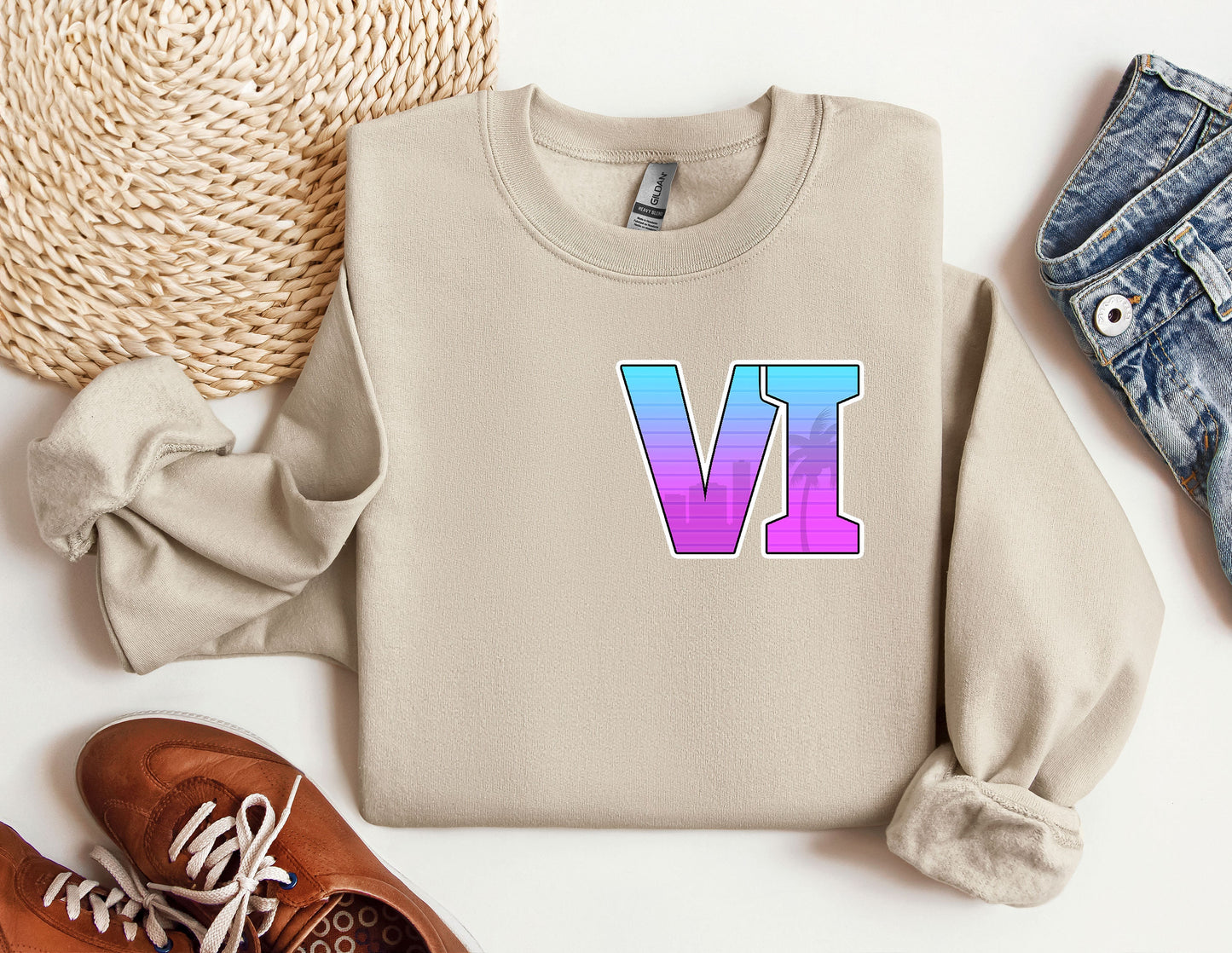 a sweater with the letter v on it next to a pair of shoes