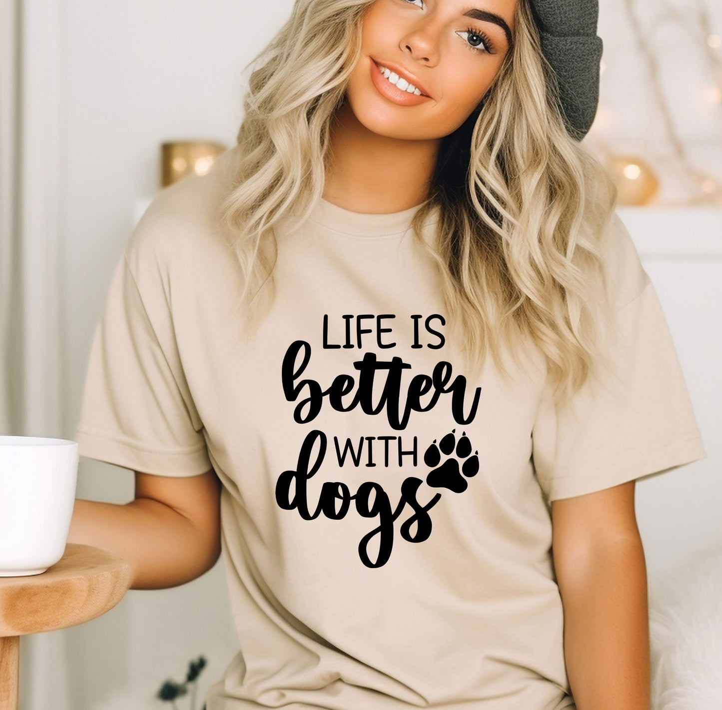 a woman wearing a t - shirt that says life is better with dogs