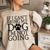 a woman wearing a sweatshirt that says if i can't bring my dog i