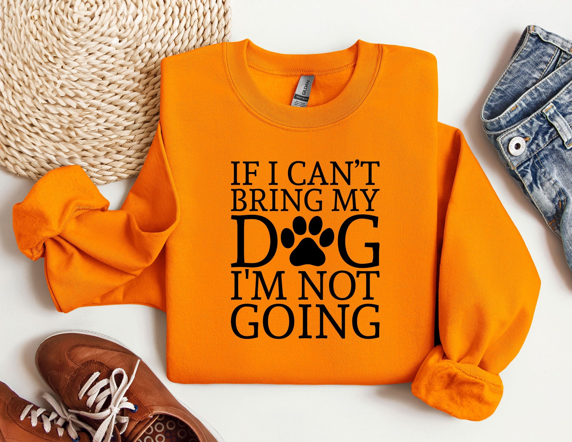 an orange shirt with a dog&#39;s paw on it