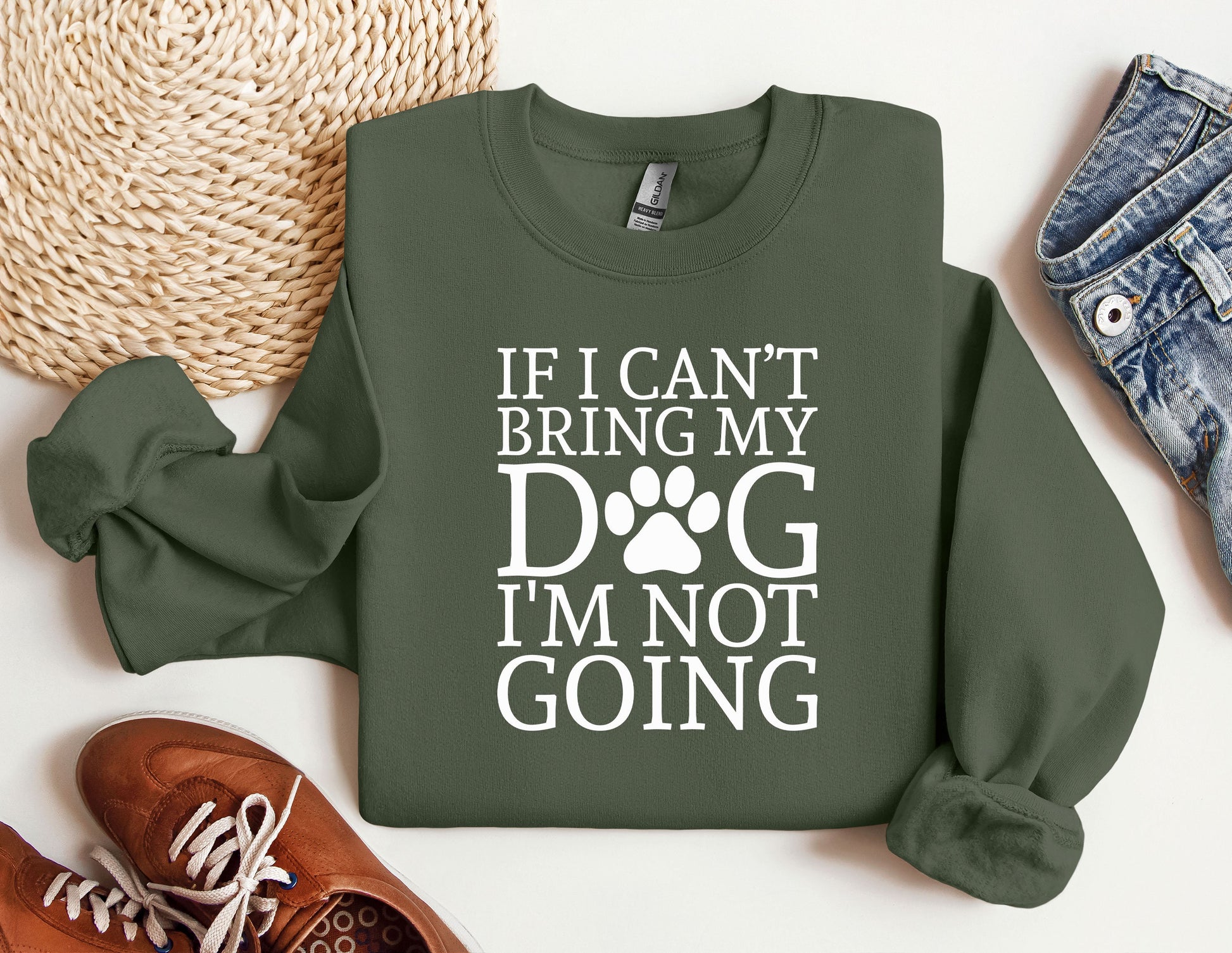 a green sweatshirt with a dog&#39;s paw on it