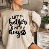 a woman wearing a sweatshirt that says life is better with a dog