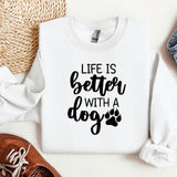 a sweater with a dog's paw on it next to a pair of shoes