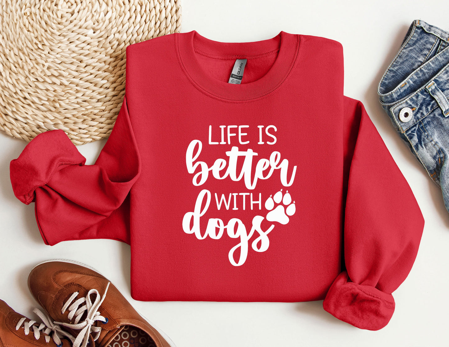 a red sweatshirt with the words life is better with dogs printed on it