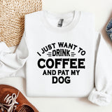 a white sweatshirt with a black print that says i just want to drink coffee and