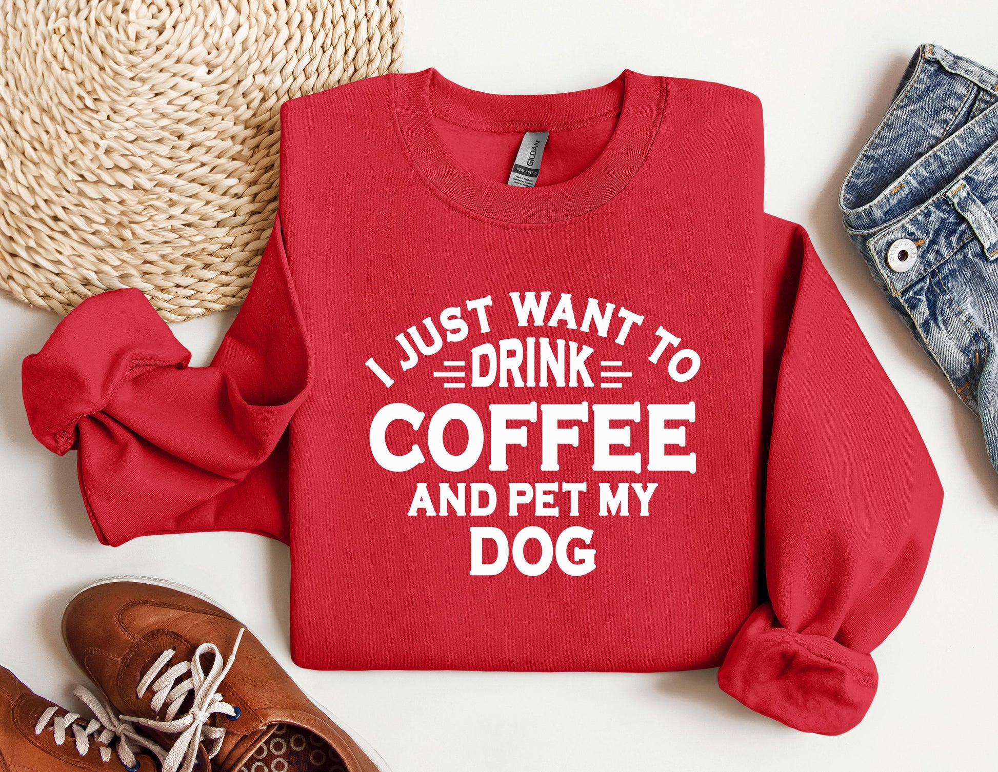 a red sweatshirt that says i just want to drink coffee and pet my dog