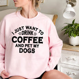 a woman sitting on a bed wearing a pink sweatshirt