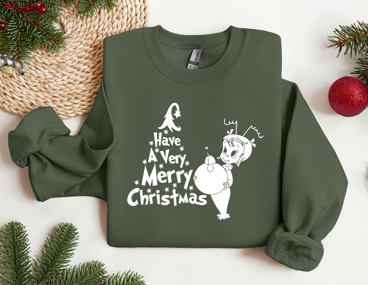 a green sweatshirt with a christmas message on it