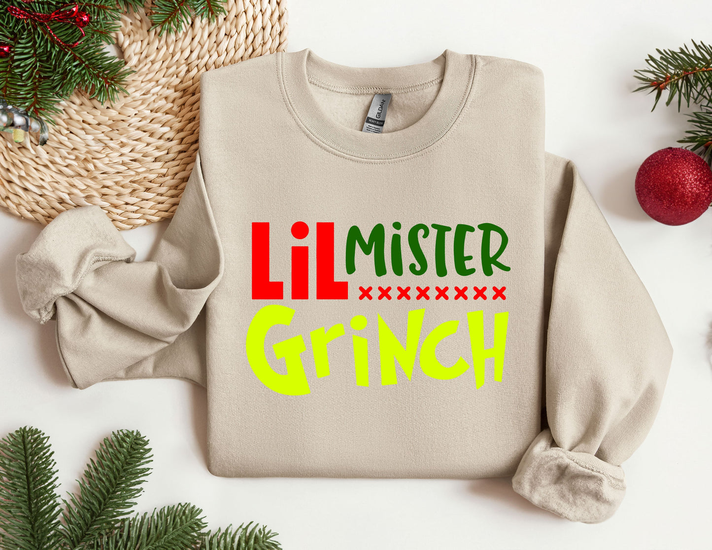 a sweater with the words lil mister grin on it