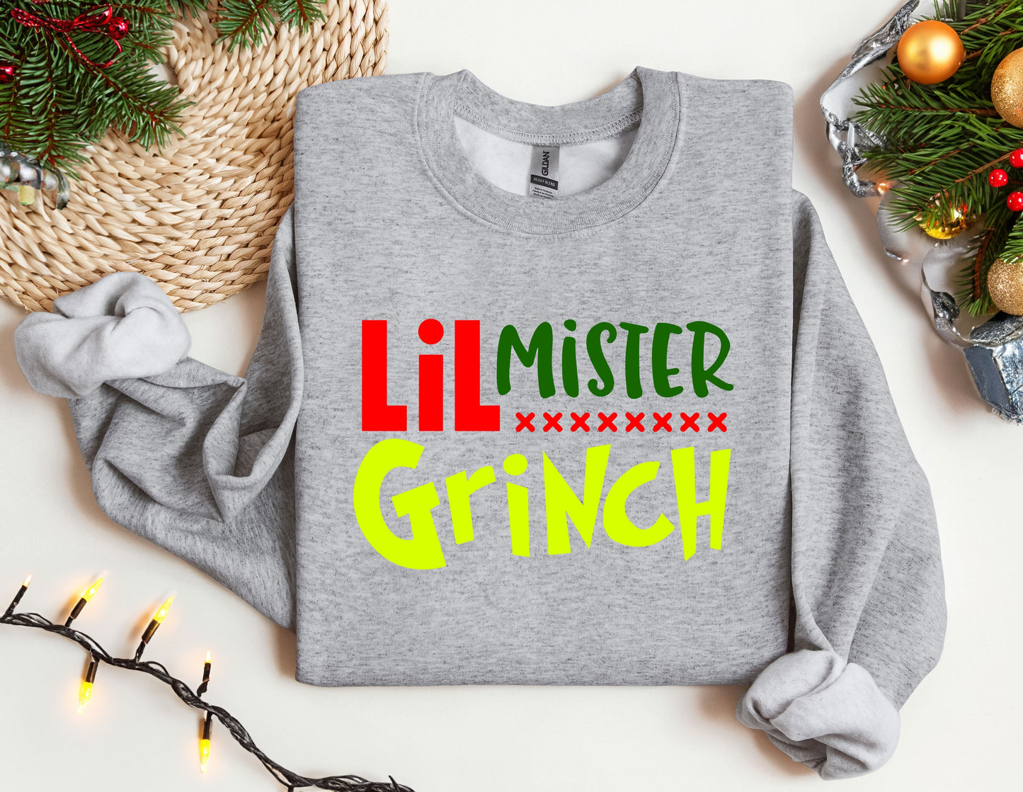 a sweater with the words lil mister grin on it