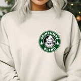a woman with grey hair wearing a starbucks sweatshirt