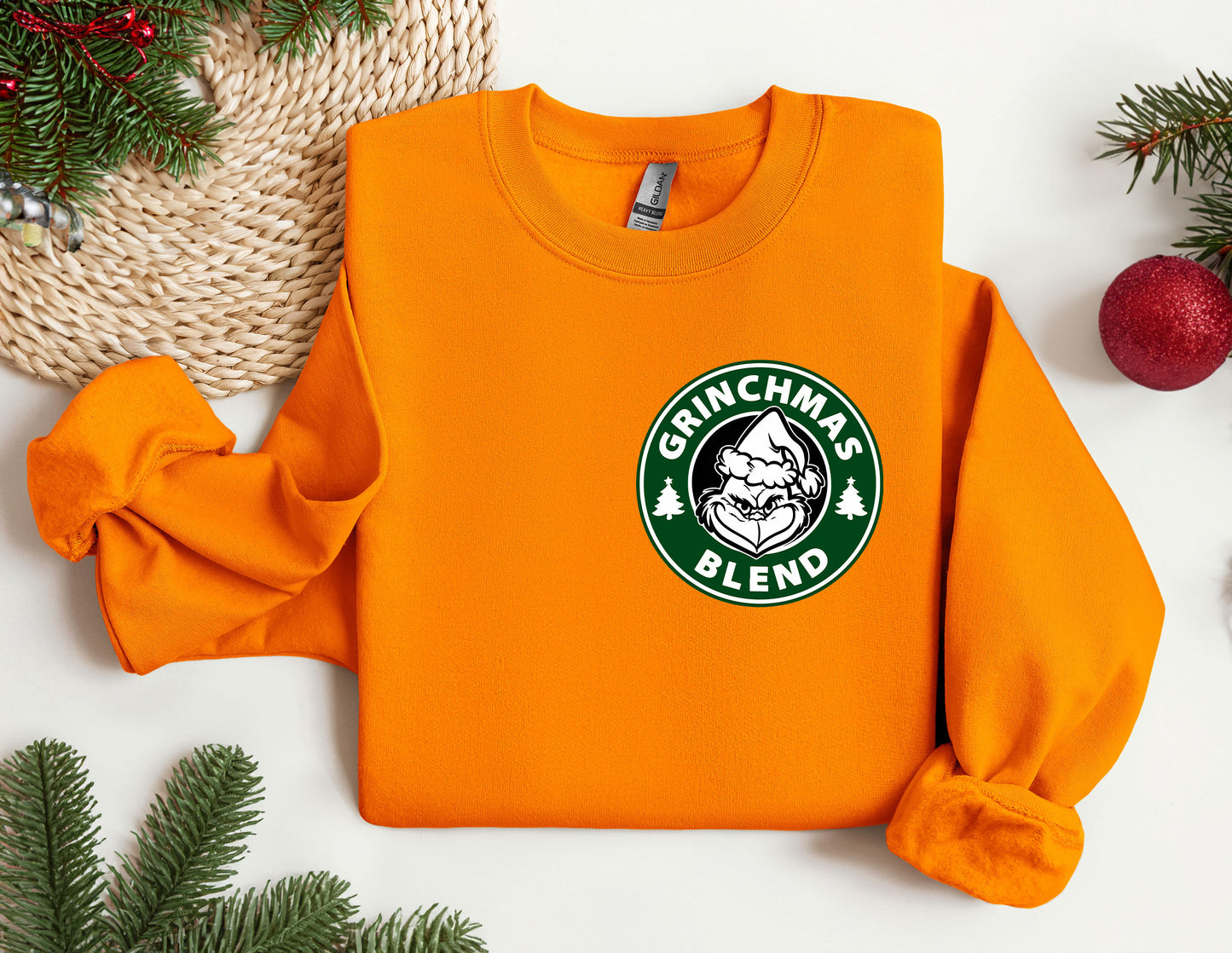 an orange sweatshirt with a starbucks logo on it