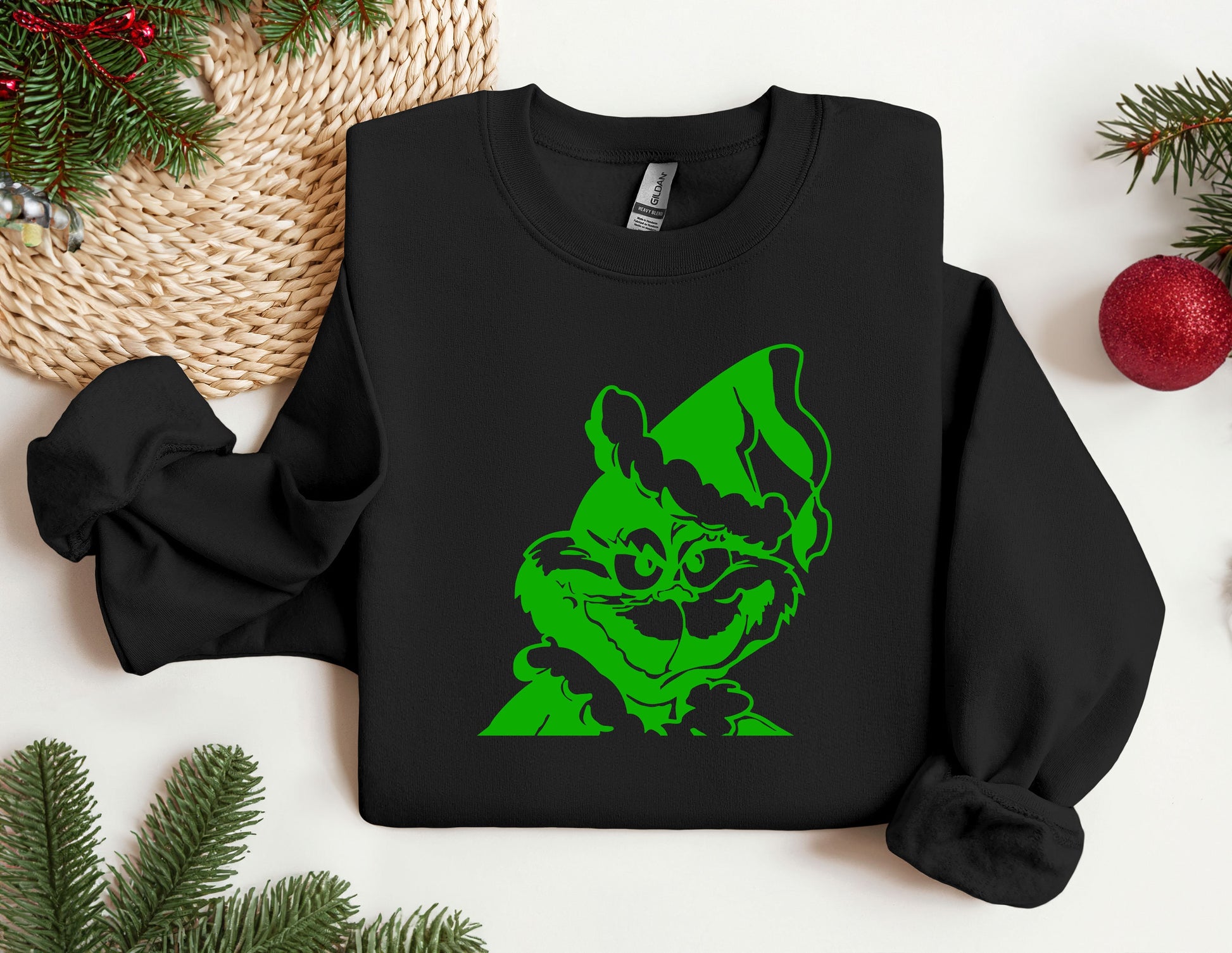 a black shirt with a green image of a dog