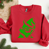 a red sweater with a green cat on it