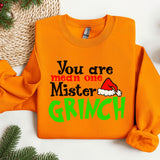 an orange sweater with the words you are mean one mister grin on it