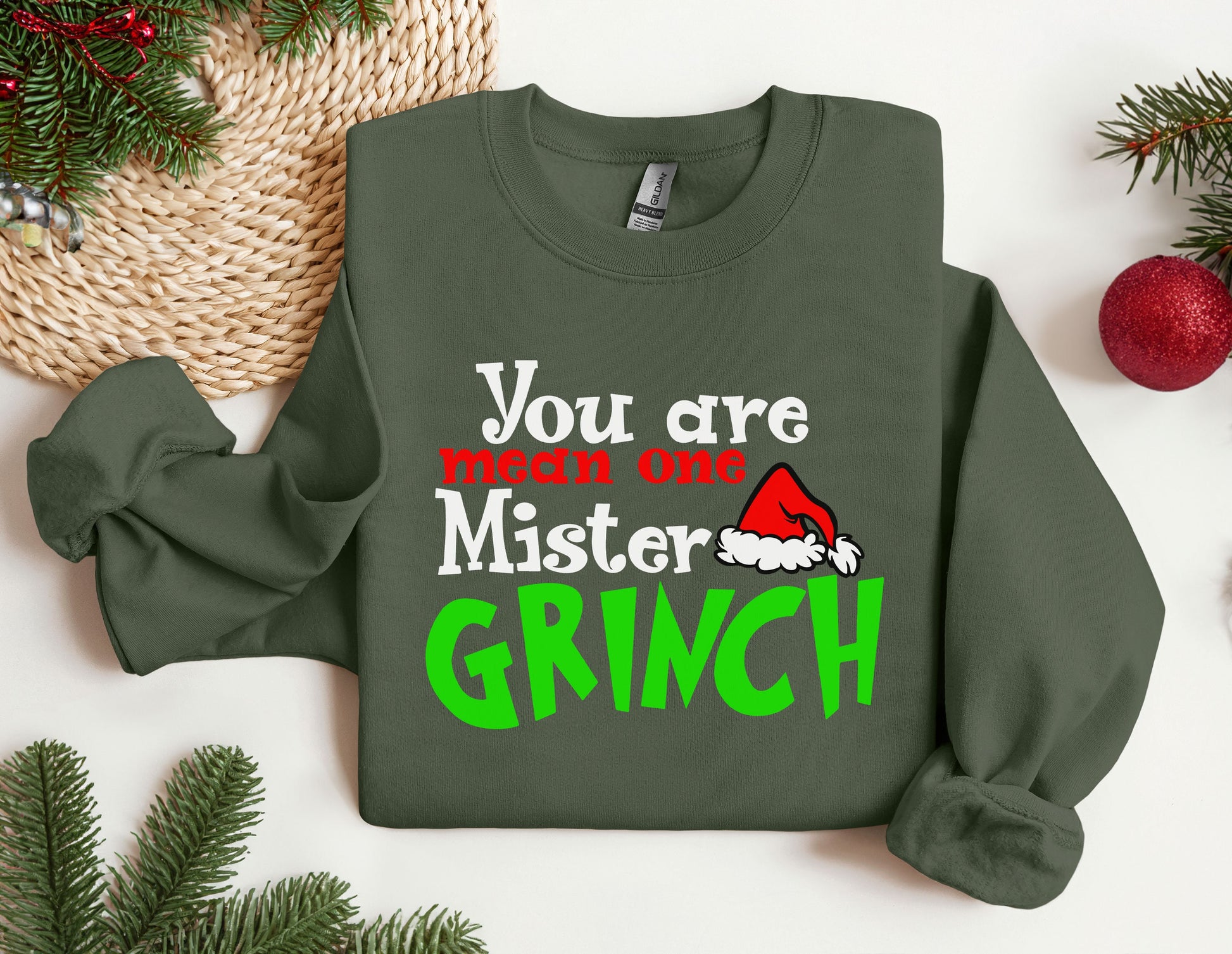 a green sweater with a santa hat on it