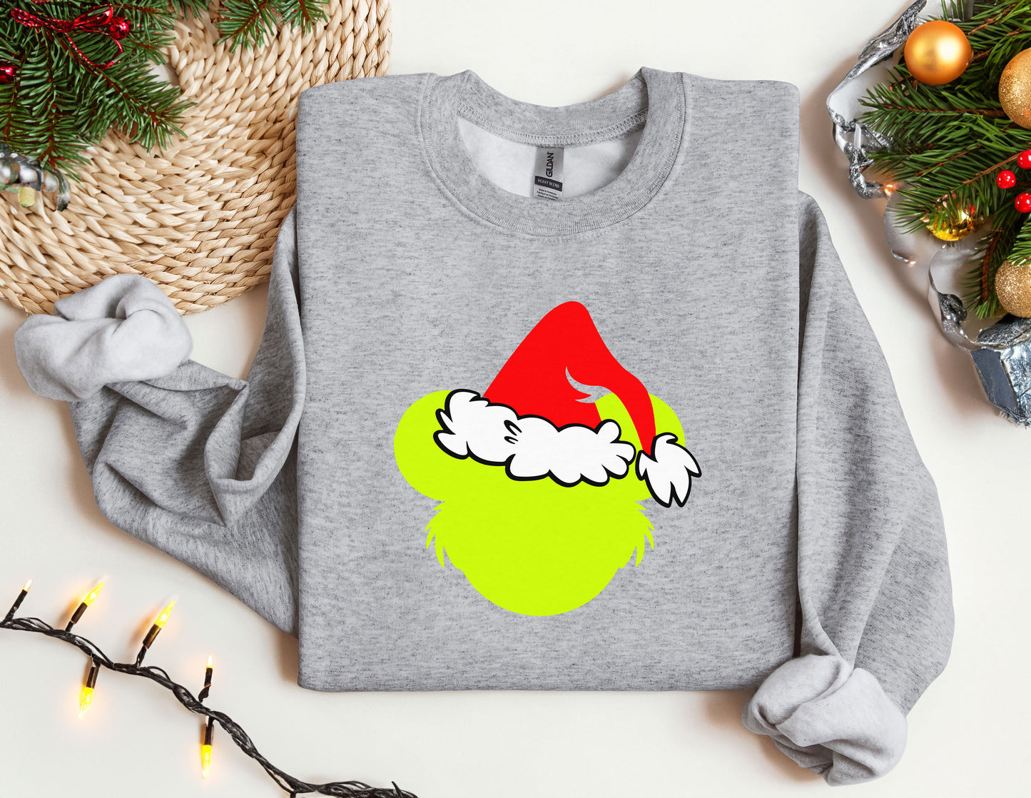 a grey sweatshirt with a santa hat on it