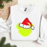 a white sweatshirt with a green grin face on it