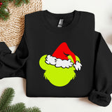 a black shirt with a green grin face on it