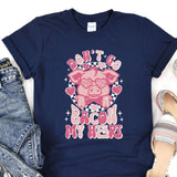 a t - shirt with a pink pig on it