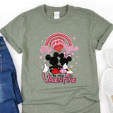 a couple of mickey and minnie mouse shirts